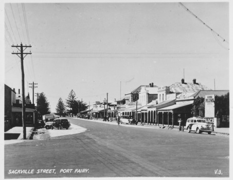 Main Street of Port Fairy with shop verandahs on both sides of street 