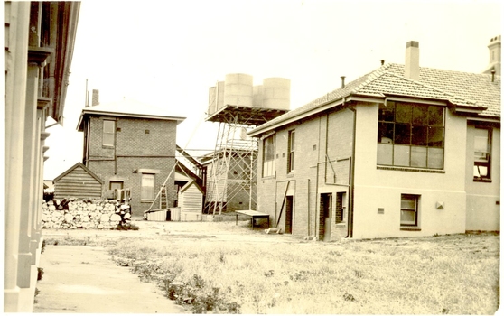 Back of new extension to the hospital with large water tanks