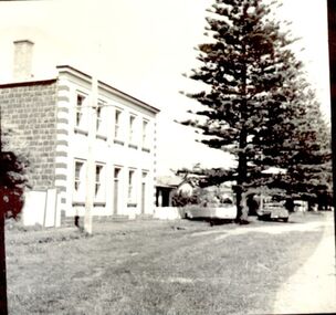Two story bluestone market hotel with rendered front and checkered quoins