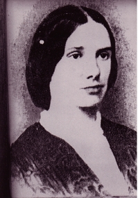 Portrait of woman with long hair parted in the middle 