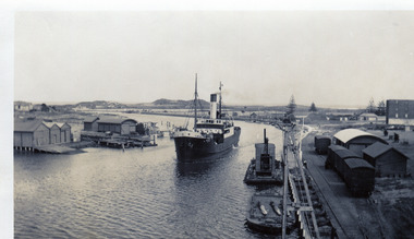 Moyne river with ship making way to wharf