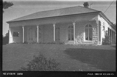 Front of Seaview showing bay window and verandah bluestone painted white
