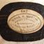 underside of the hat badge with the details of the manufacturer Chas.R.Martin 