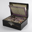 Open sewing box showing insert in lid and sewing items in the top tray