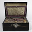Sewing box front on displaying it’s shell inlaid keyhole and the ruched lid insert
