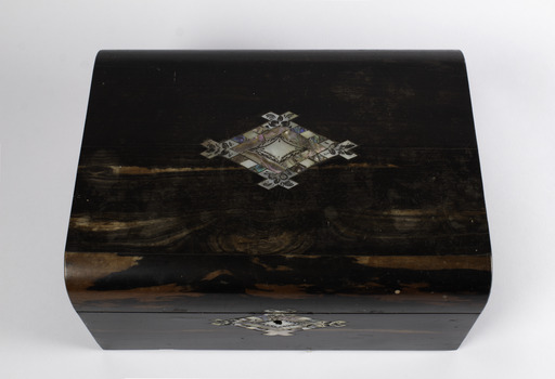 Sewing boxed closed displaying the shell inlaid design on the top