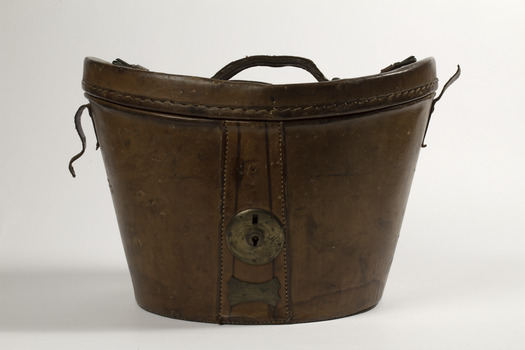 Leather oval shaped hat box with brass lock and leather handle