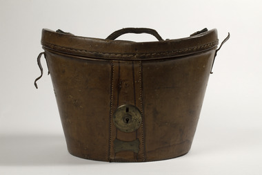 Leather oval shaped hat box with brass lock and leather handle