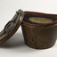 Leather hat box opened with top hat  upside down inside
