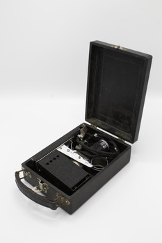 The projector folded into the case