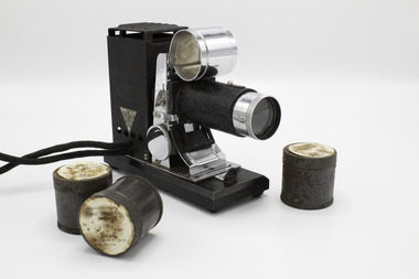 Small film projector with 3 film tins