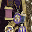 Detail of the four medals attached to collar