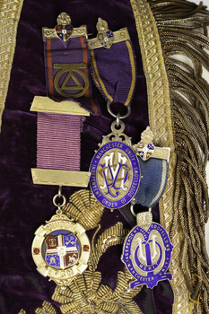 Detail of the four medals attached to collar