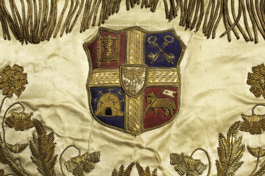 Detail of gold embroidery on ceremonial apron
