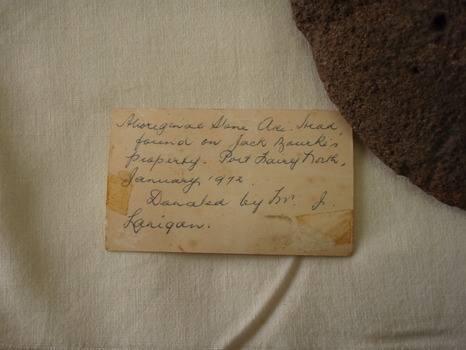 Old label written for the axe head 