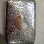 Top of silver cigar case with embossing and engraving
