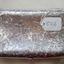 Underside of silver cigar case continuation of detailed decoration