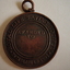 Obverse side of Royal Life Saving medal for Mr Arnett