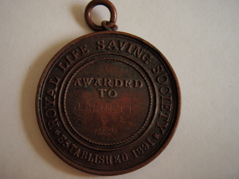 Obverse side of Royal Life Saving medal for Mr Arnett