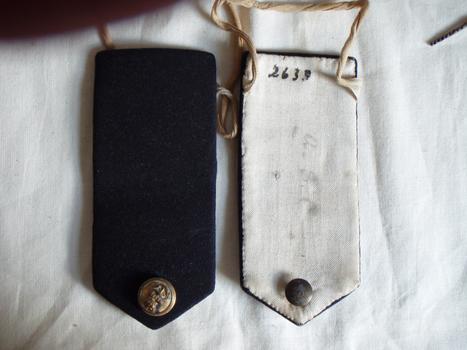Both sides of navy epaulettes complete with naval buttons