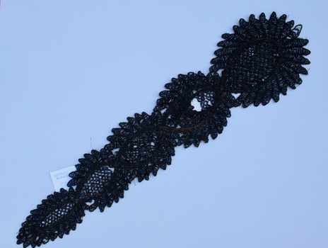 intricate black bead panel with cross hatching
