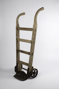 Ship’s cargo trolley with 4 braces and one handle longer than the other with heavy metal wheels and step 