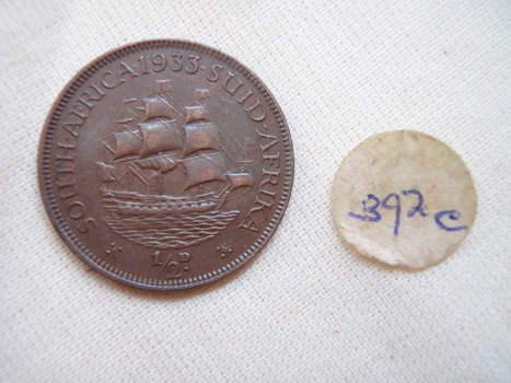 Sailing ship in full sail with text around rim (reverse)