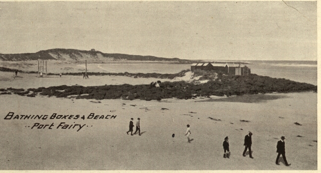 Bathing boxes, people and the set of swings on the South Beach