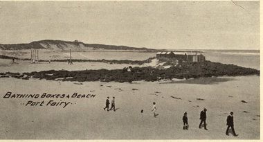 Bathing boxes, people and the set of swings on the South Beach