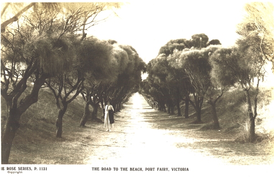 Woman standing to left on track which leads to South Beach