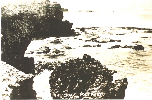 Rocky area with ocean waves washing over 
