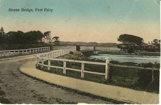 Curve of road onto Moyne traffic bridge with house on East bank on left