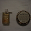 Back of bottle with clear liquid-back of tin with instructions for use