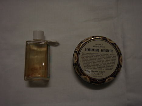 Back of bottle with clear liquid-back of tin with instructions for use