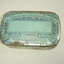 Retangular with rounded corners tin painted pale blue with navy writing on face
