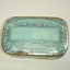 Retangular with rounded corners tin painted pale blue with navy writing on face