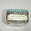 End of tin has paper label added which reads sugarless fruit pastilles net weight 4 ozs