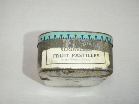 End of tin has paper label added which reads sugarless fruit pastilles net weight 4 ozs