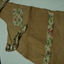 hessian bag apron with floral pocket, floral ties and neck piece as well as a strip of floral material around the skirt