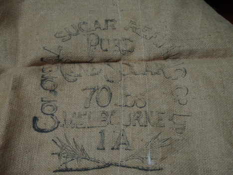 Reverse side of apron showing the brand from the sugar company that produced it