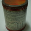 Back of milk powder tin with analysis chart and instructions for use