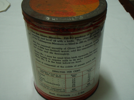 Back of milk powder tin with analysis chart and instructions for use