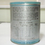 Back of milk powder tin with blue markings with a table of quantities for feeding to infants