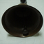 inside of bell showing brass round clapper on chain