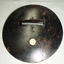 Metal circle with round attachment hole and long slit with a cover and wire barrier