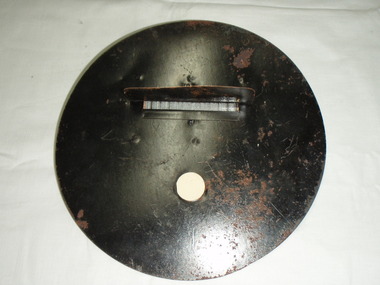 Metal circle with round attachment hole and long slit with a cover and wire barrier