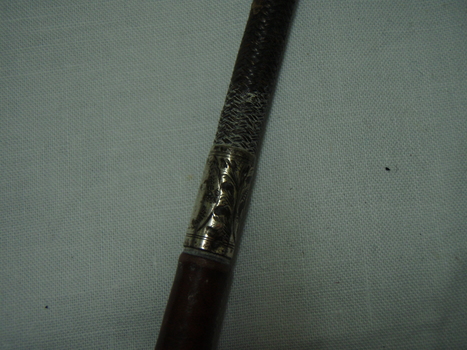 Dear ail of decoration on silver band on crop