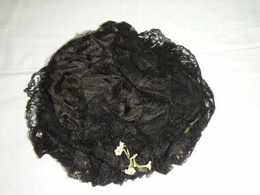 Black lacy net hat with wax flower 