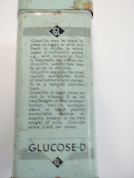 Side of Glucodin tin describing the dosage recommended and manufacturers marks