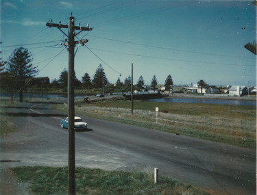 Coloured photograph of the traffic bridge over the Moyne river from Gipps Street